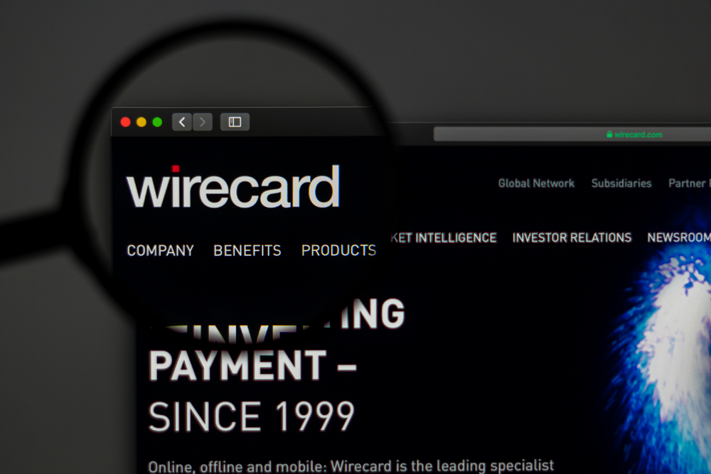 Wirecard payment processing website under magnifying glass.
