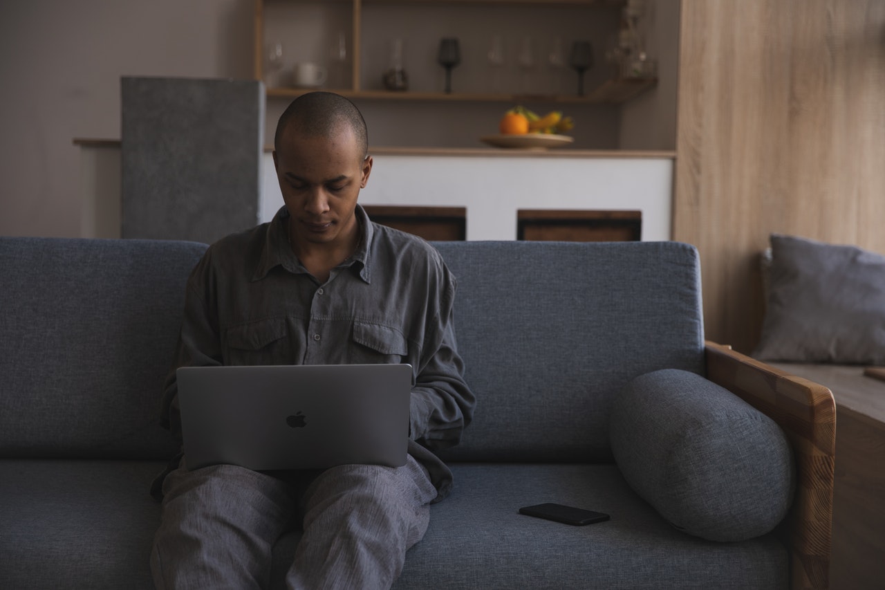 man in online therapy session