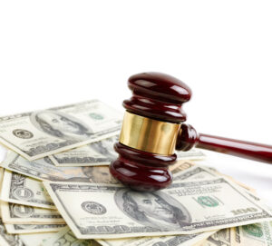 Gavel on top of a pile of US dollars