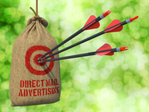 Arrows hitting the bullseye of a sandbag labeled "Direct Mail Advertising"