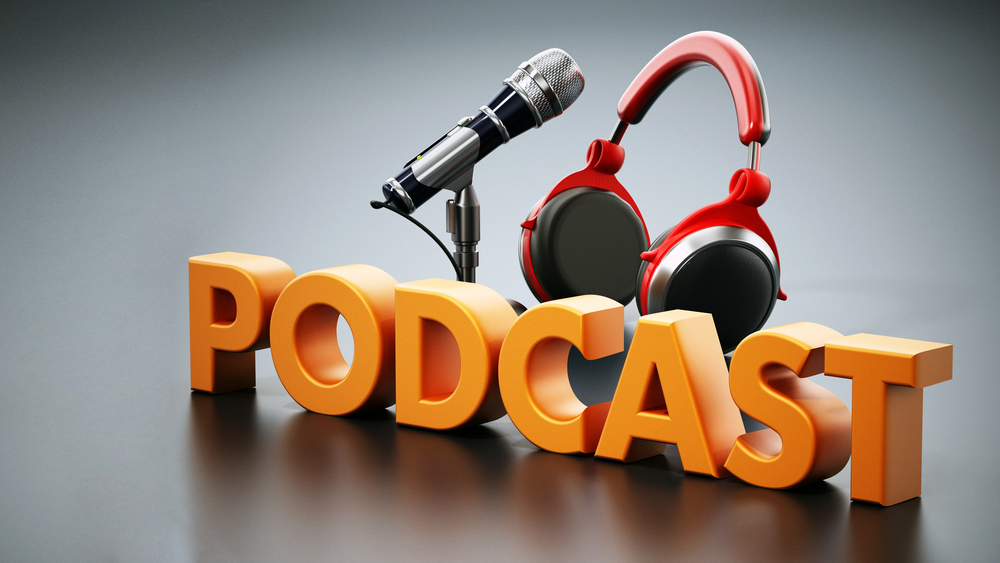 "PODCAST" in 3d text in front of a microphone and headphones