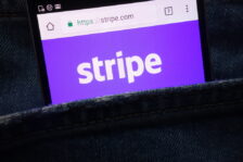 "Stripe" logo in white text on a purple background displayed on a mobile phone using Google Chrome