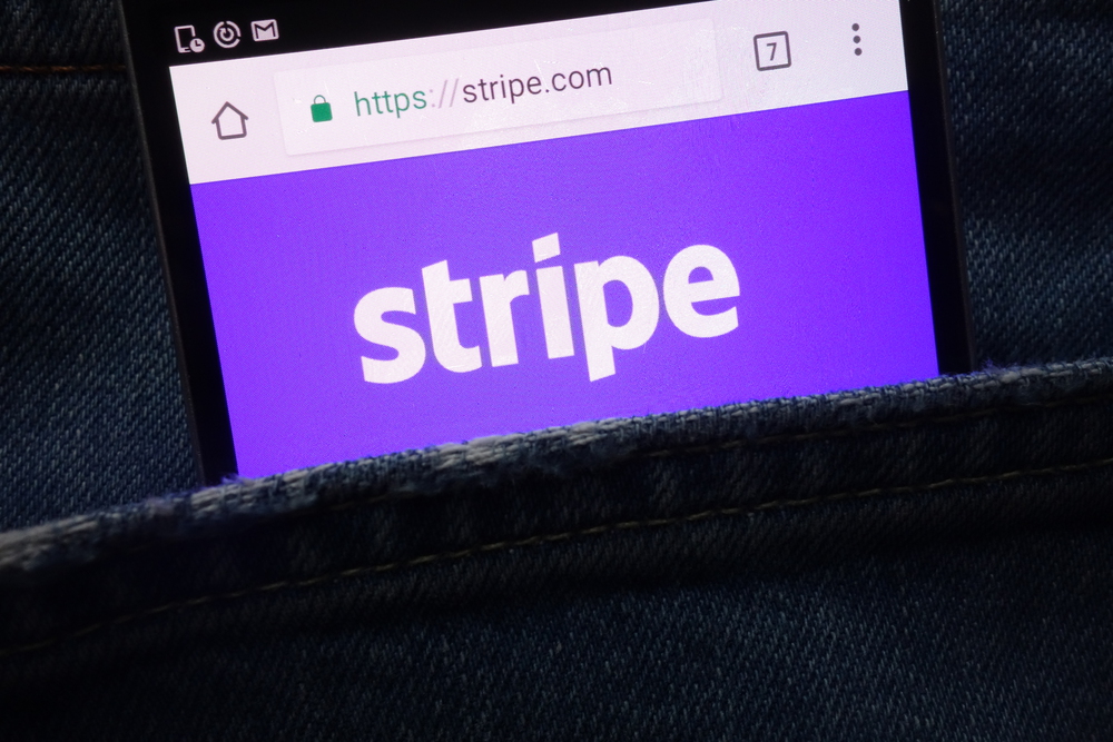 "Stripe" logo in white text on a purple background displayed on a mobile phone using Google Chrome