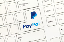 Close-up view on white conceptual keyboard - PayPal (key with logotype)