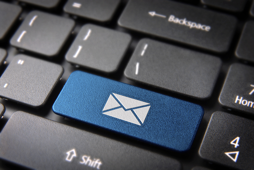 Blue email button on a black physical keyboard