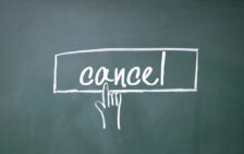 the word "cancel" inside a white outlined rectangle representing a clickable button with a finder pointed at it. Everything is drawn on a blackboard.