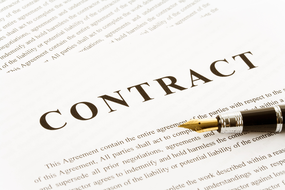 A pen on top of a contract