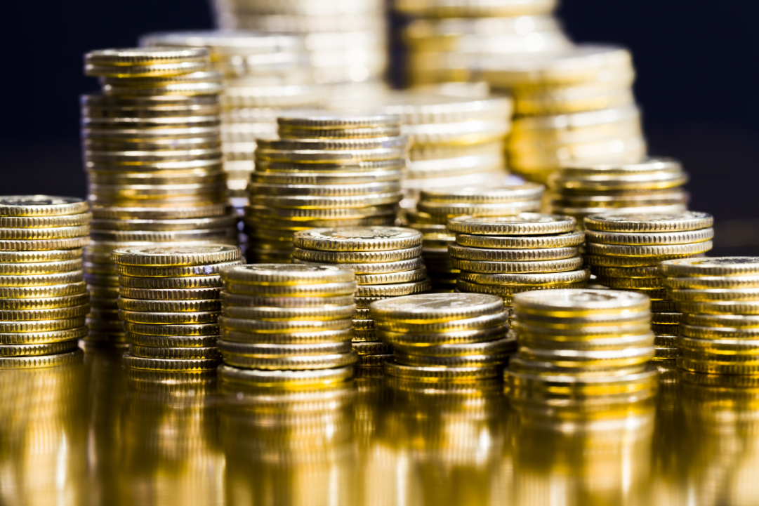 round metal coins of Golden color, legal tender that is used for payments in the state, beautiful coins closeup, different coin denominations