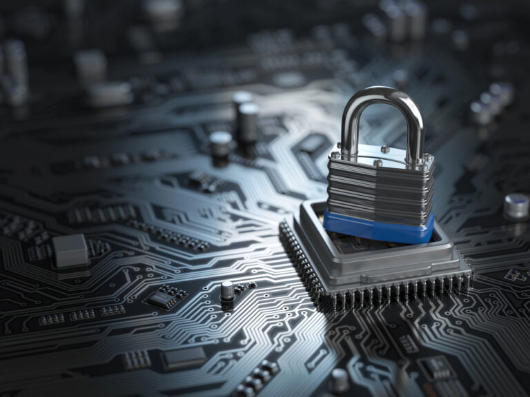A padlock resting on top of a computer chip surrounded by technology, data security