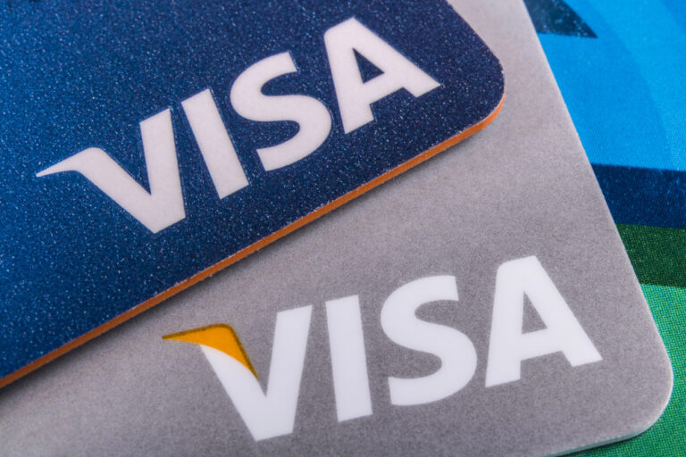Two credit cards displaying the VISA logo