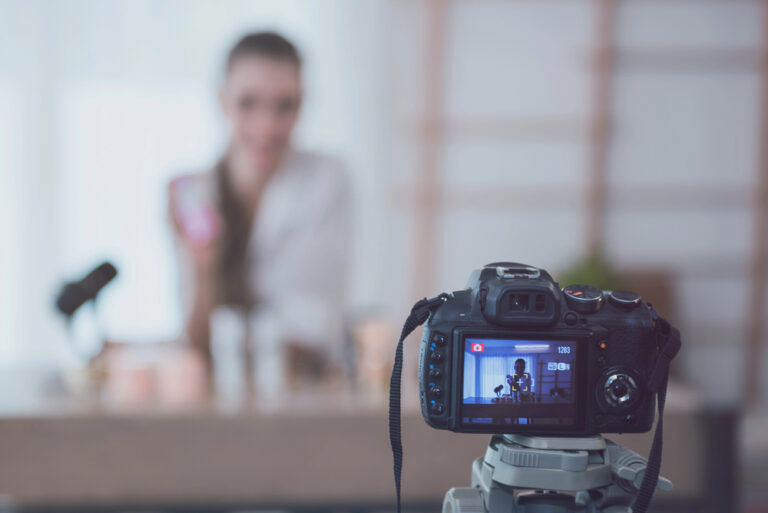 Beautiful young girl blogger is live streaming. beauty blogger talks about cosmetics. the concept of opinion leaders.