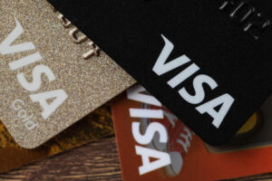 Visa credit cards on wooden table, closeup